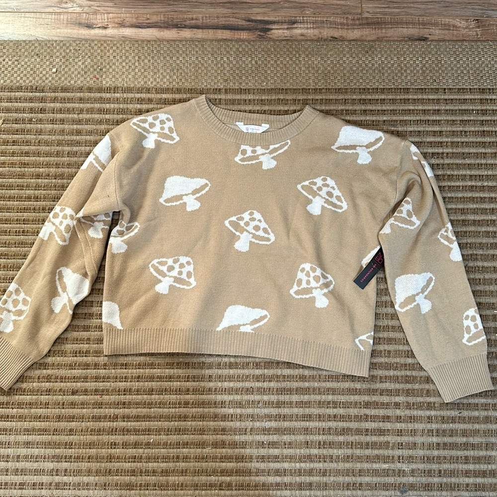 I am selling a kid sweatshirt size large and it is a mushroom sweatshirt